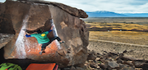 Man With Prosthetic Leg Scaling Side Of Cliff