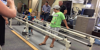 Young Boy With Prosthetic Leg During Physical Therapy