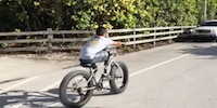 Boy With Prosthetic Leg Riding a Bike